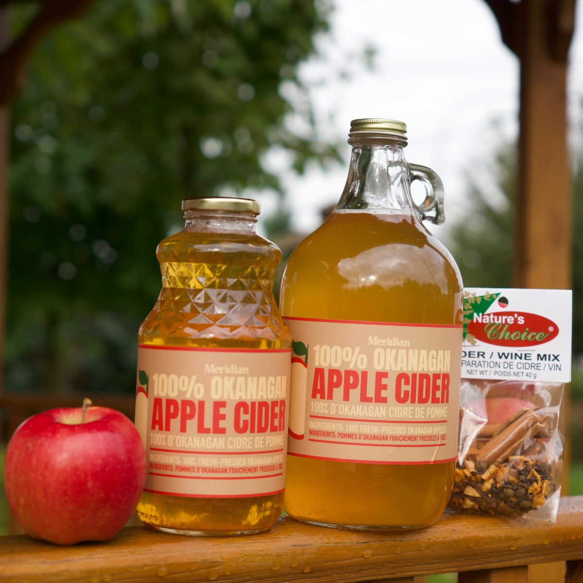 Meridian Okanagan Apple Cider 909 ml and 1.89L next an apple and cider wine mix.