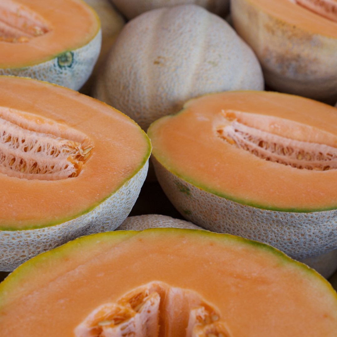Sliced open cantaloupes close up and facing up