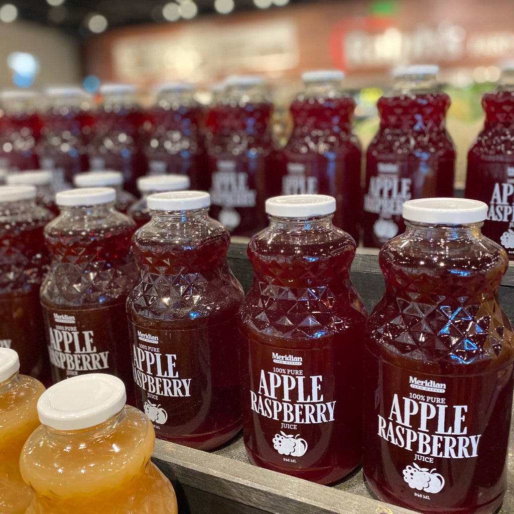 Meridian Farm Market Apple Raspberry Juice 946 ml sitting in rows on display.