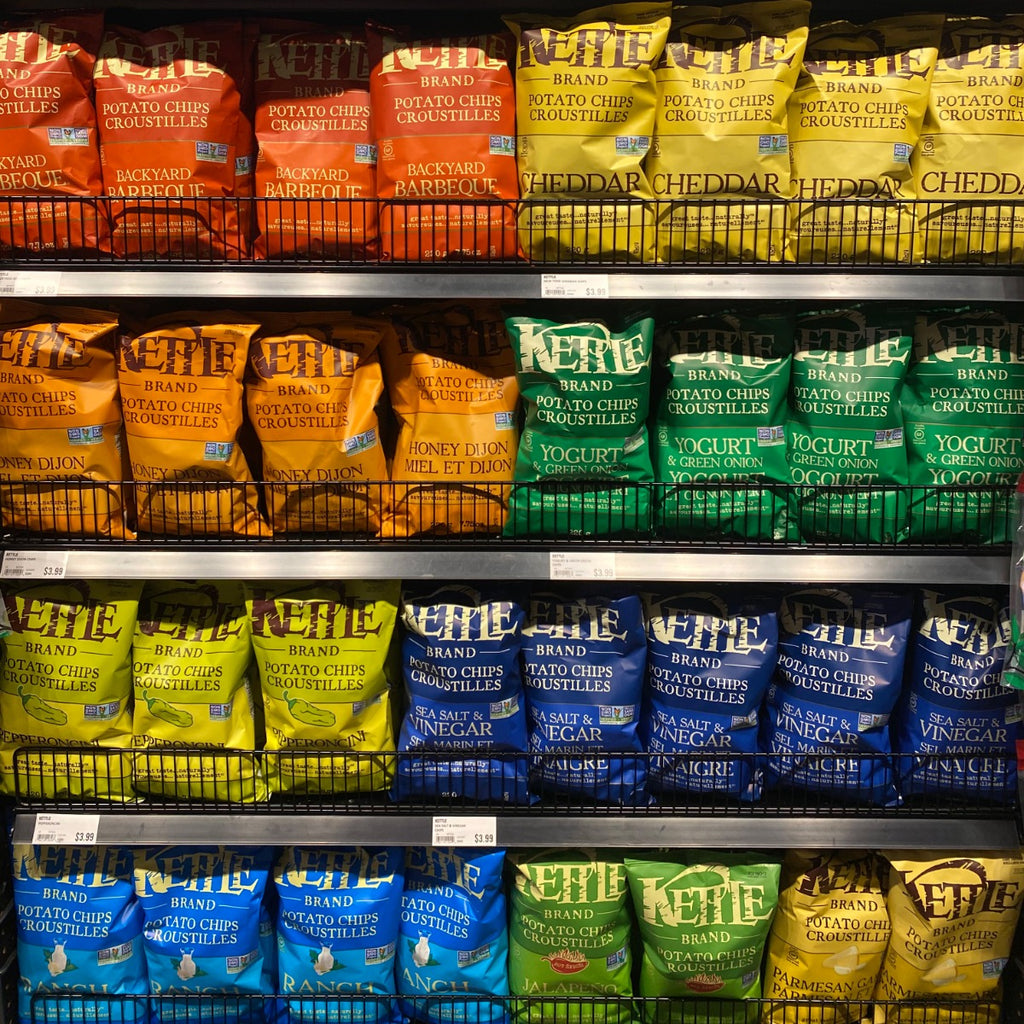 Kettle Brand Sea Salt and Vinegar Chips displayed next to an assortment of Kettle Brand Chips.