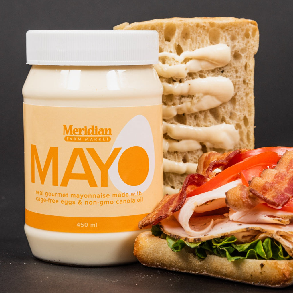 Meridian gourmet mayonnaise spread all over a chicken bacon lettuce sandwich.